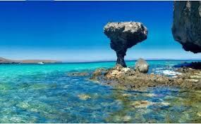 Mushroom Rock formation in the crystal-clear waters of the Sea of Cortez near La Paz, Mexico, viewed on a private yacht cruise. 
