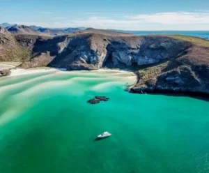 A top Yacht Charter La Paz - Lover lips Arial view of a Lover Lips Yacht anchored in the turquoise water of Balandra Beach in La Paz, Mexico