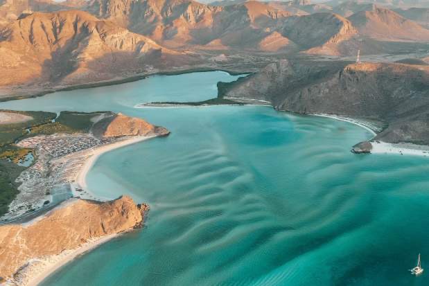 Balandra Beach La Paz yacht charter with turquoise water and private luxury yacht