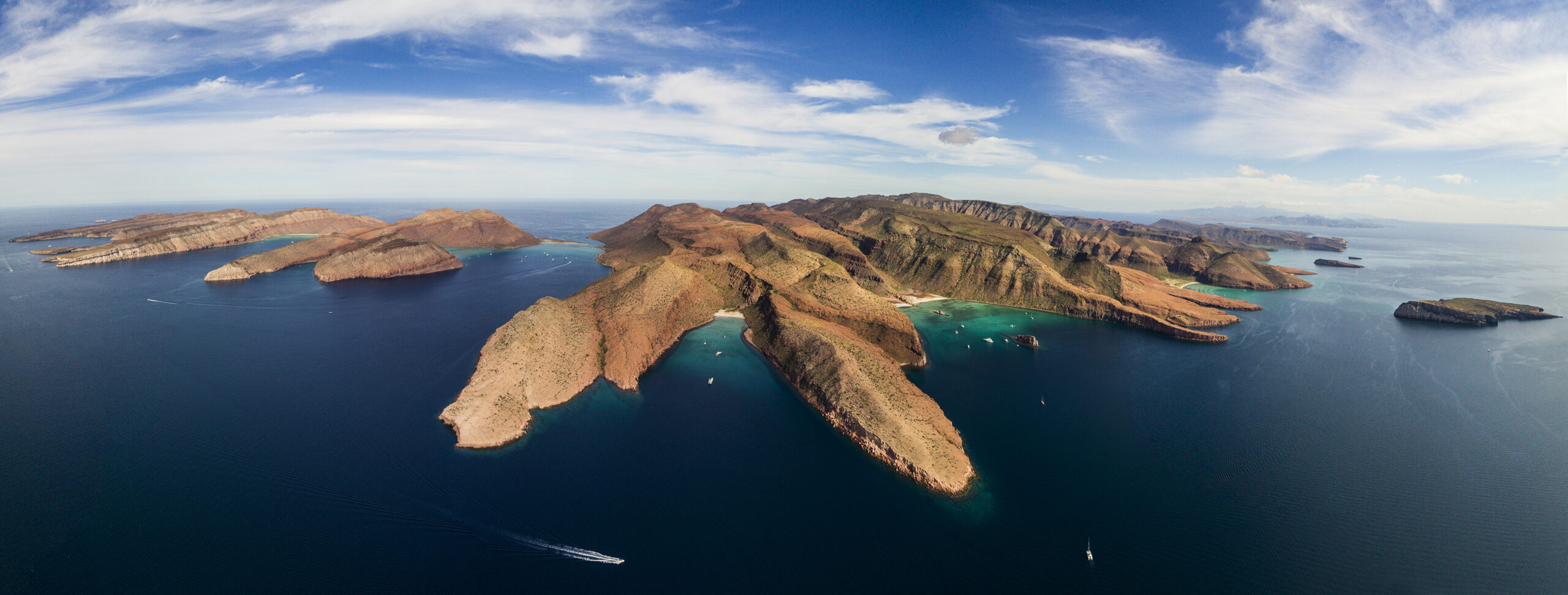 Aerial view of Isla Espíritu Santo coastline in the Sea of Cortez, a popular destination for private yacht charters from La Paz, Mexico