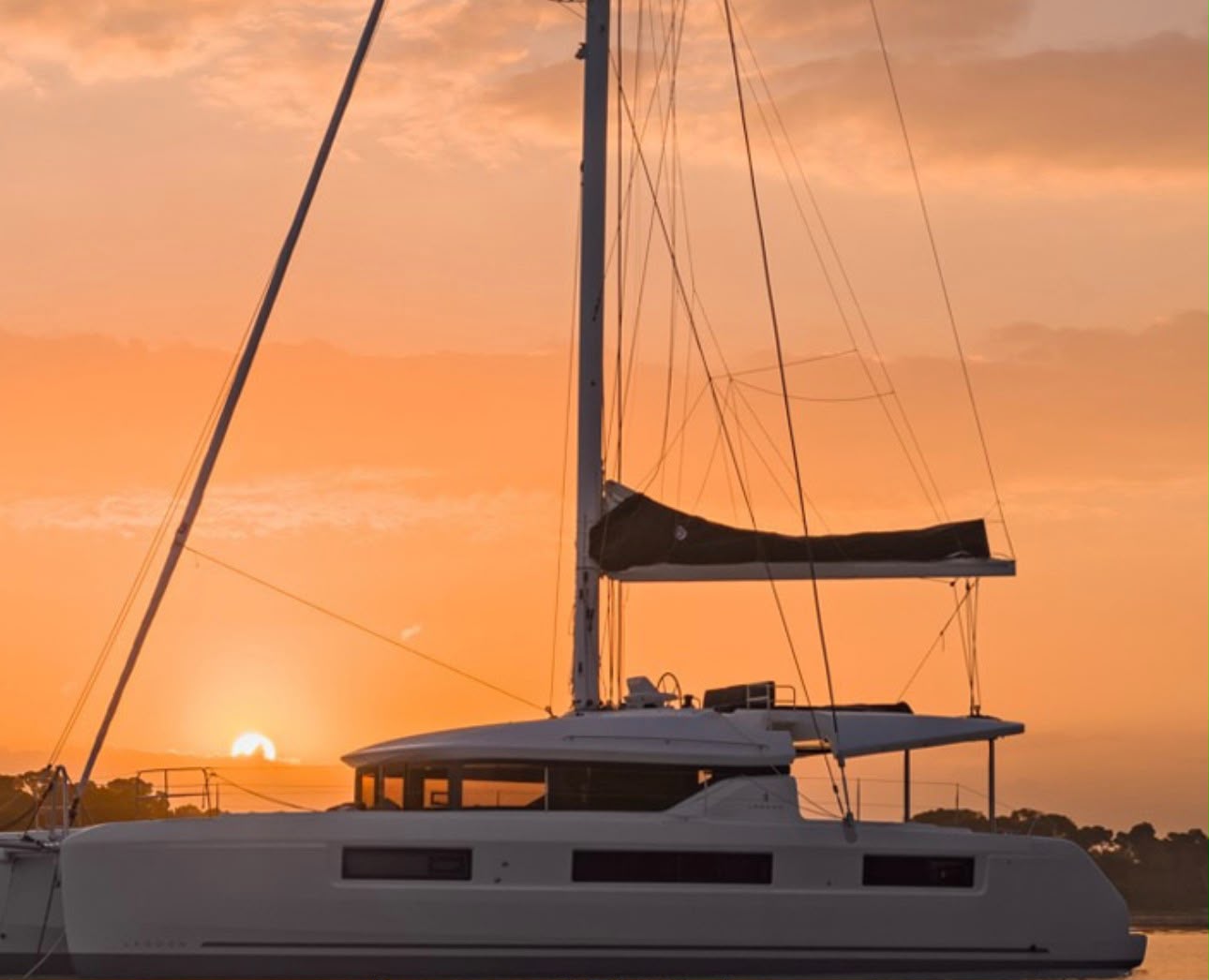 Luxury catamaran villa charter at sunset in La Paz, Mexico