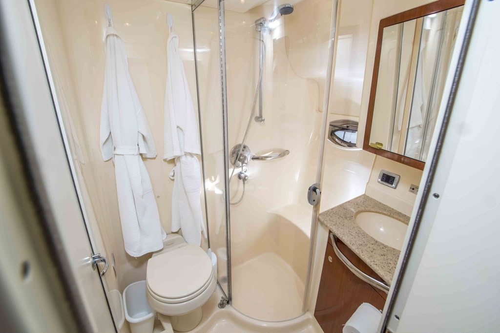 Cabo2Vegas bathroom with stand-up shower, vanity and robes