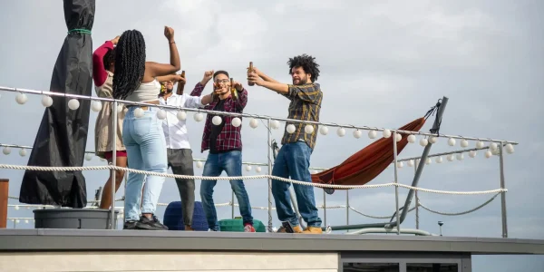 Group of friends celebrating on a Luxury yacht charter in La Paz with Loer Lips Yachts